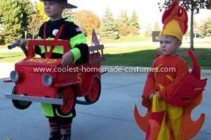 El mejor traje de camión de bomberos, bombero y pareja de llamas.